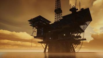 jack up rig offshore in mezzo al mare all'ora del tramonto foto