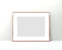 Mockup di cornice in oro rosa a4 su sfondo bianco. Rendering 3d orizzontale 2x3 foto