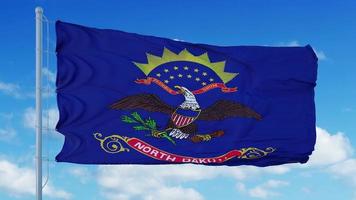 bandiera del nord dakota su un pennone che sventola nel vento, sfondo azzurro del cielo. rendering 3D foto