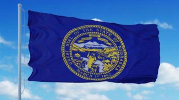 bandiera del nebraska su un pennone che sventola nel vento, cielo blu sullo sfondo. rendering 3D foto