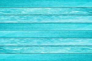 struttura della plancia di legno di colore azzurro brillante. fondo di legno della spiaggia dell'annata. foto