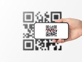 mano utilizzando il codice QR di scansione dello smartphone mobile. lettore di codici a barre, pagamento con codice QR, tecnologia senza contanti, concetto di denaro digitale foto