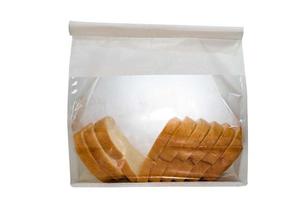 fetta di pane della pagnotta nel pacchetto della borsa su fondo bianco. foto
