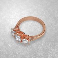 Anello di fidanzamento con 3 pietre che stabilisce la posizione in oro rosa 3d rendering foto