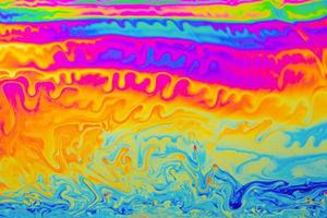 astratto sfondo multicolore psichedelico. colori dell'arcobaleno. sfondo di modelli. foto macro colpo di bolle di sapone