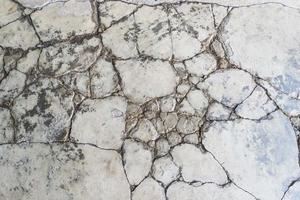 fondo del pavimento di cemento incrinato foto