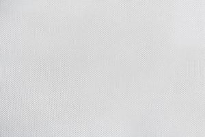 trama di tela bianca con piccoli pezzi di scaglie di materiale, sfondo con motivo astratto foto