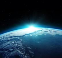 vista del pianeta terra blu con il sole che sorge dallo spazio. elementi di questa immagine forniti dalla nasa. foto