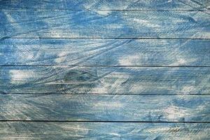 texture di sfondo in legno blu vintage con nodi e fori per unghie. vecchio muro di legno dipinto. sfondo astratto blu. tavole orizzontali blu scuro in legno vintage. foto