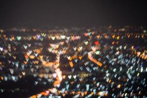 astratto, bellissimo paesaggio bokeh della città di notte, luce bokeh e tramonto della città sfocato foto