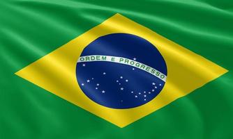 primo piano sventolando la bandiera del brasile foto
