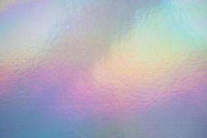uno sfondo di lamina olografica iridescente colori pastello foto