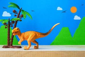 modello giocattolo velociraptor su sfondo di modelli selvaggi foto