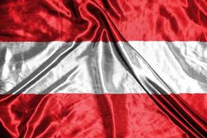 bandiera di stoffa austria bandiera in raso sventolando la trama del tessuto della bandiera foto