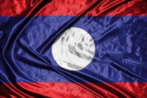 laos bandiera di stoffa bandiera di raso sventolando la trama del tessuto della bandiera foto