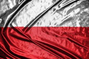 bandiera di stoffa polacca bandiera di raso sventolando la trama del tessuto della bandiera foto