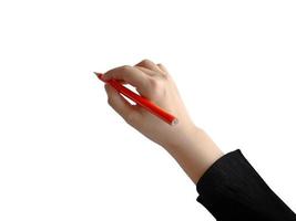 mano femminile isolata che tiene la scrittura a matita di colore arancione, per l'elemento di presentazione foto