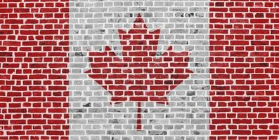 bandiera del Canada dipinta su un muro di mattoni foto