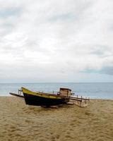 carta da parati bella barca sulla spiaggia foto