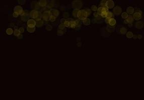 sfondo bokeh giallo dorato c'è una scintilla di luci, idee per feste di Natale e Capodanno. foto