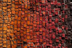 mosaico di piccoli ciottoli rossi, gialli, marroni, arancioni, luminosi. foto
