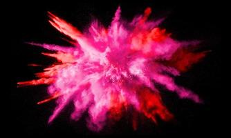 esplosione di polvere colorata, isolata su sfondo nero foto