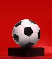 pallone da calcio sul podio del pentagono nero nello studio rosso foto
