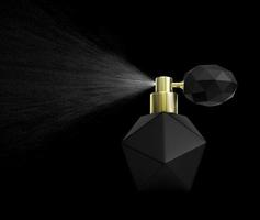 bottiglia nera di profumo spray isolato su sfondo nero foto