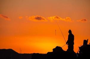 sagoma di canna da pesca pescatore foto