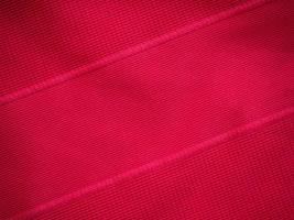 struttura in jersey di tessuto di abbigliamento sportivo rosso foto