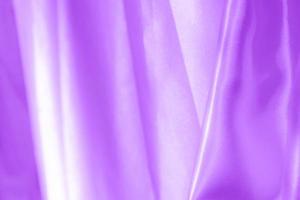 Proton viola tessuto di raso texture morbida sfocatura dello sfondo foto