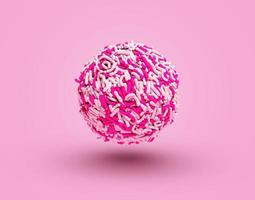 brigadeiro con confettini bianchi rosa, brigadiere di caramelle brasiliane, palline di tartufo con cospargete di caramelle dolci fatte a mano foto