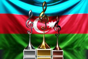 premi in chiave di violino per aver vinto il premio musicale sullo sfondo della bandiera nazionale dell'azerbaigian foto