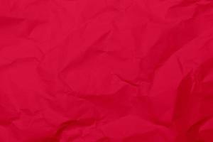 sfondo di struttura di carta stropicciata rossa. sfondo di struttura di carta rugosa rossa. sfondo di struttura del tessuto piega rossa. fondo di struttura del tessuto rugoso rosso.