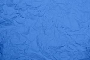 sfondo di struttura di carta stropicciata blu. sfondo di struttura di carta rugosa blu. sfondo di struttura del tessuto piega blu. sfondo blu tessuto rugoso.