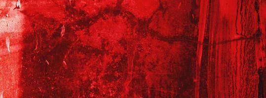 parete rossa.sfondo spaventoso.muro di cemento intonacato sfondo rosso antigraffio.struttura del grunge. foto