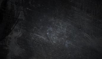 concetto di sfondo di halloween muro scuro e nero. cemento nero polveroso per lo sfondo. trama di cemento horror foto