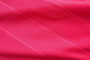 struttura in jersey di tessuto di abbigliamento sportivo rosso foto