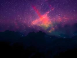 via lattea e luce rosa in montagna. paesaggio colorato notturno. cielo stellato con colline. bellissimo universo. sfondo dello spazio con la galassia. sfondo di viaggio foto