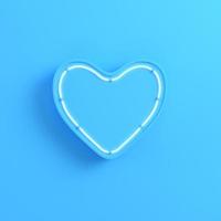 cuore con luce al neon su sfondo blu brillante foto