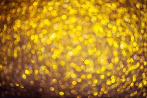 golden glitter bokeh illuminazione texture sfocato sfondo astratto per compleanno, anniversario, matrimonio, capodanno o natale foto