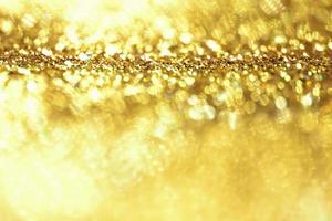 golden glitter bokeh illuminazione texture sfocato sfondo astratto per compleanno, anniversario, matrimonio, capodanno o natale foto