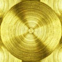 un ferro in metallo dorato con sfondo a trama circolare foto