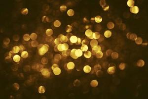 golden glitter bokeh illuminazione texture sfocato sfondo astratto per compleanno, anniversario, matrimonio, capodanno o natale foto