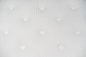 superficie del letto bianca con trama quadrata e lineare per lo sfondo. foto
