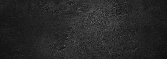 parete nera spaventosa o grigio scuro ruvida pietra granulosa texture di sfondo. cemento nero per lo sfondo. foto