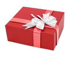 confezione regalo rossa con fiocco di nastro isolato su sfondo bianco foto