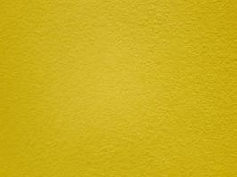 parete gialla o struttura della carta, fondo astratto della superficie del cemento, modello concreto, cemento dipinto, progettazione grafica delle idee per il web design o il banner foto