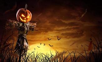 spaventapasseri di zucca di halloween su un ampio campo con la luna in una notte spaventosa