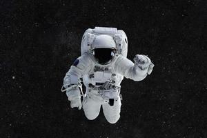 l'astronauta viaggia su uno sfondo di stelle. astronauta nello spazio esterno foto
